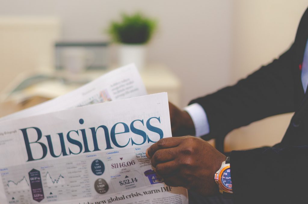 Man Holding Newspaper