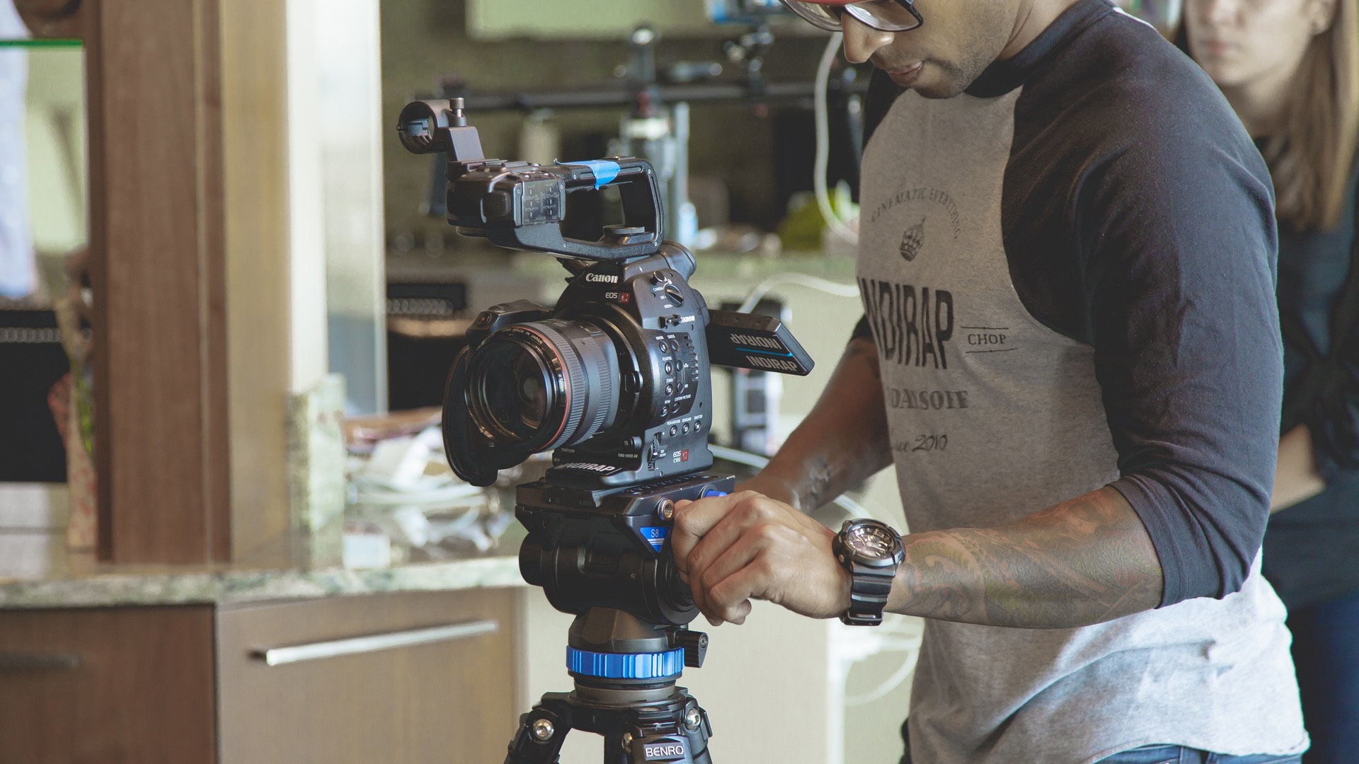 Man Adjusting Camera
